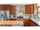 Updated kitchen with stainless steel appliances, granite counters, and tile backsplash at 2605 Cactus Cir, Golden, CO 80401