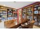 Spacious office with custom bookshelves and a large wooden desk, perfect for a home library at 2605 Cactus Cir, Golden, CO 80401