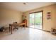 Bright home office features a wooden desk, sliding glass doors, and mountain views at 2605 Cactus Cir, Golden, CO 80401