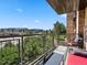 Enjoy outdoor living on this balcony, offering scenic views and a relaxing seating area at 9019 E Panorama Cir # D204, Englewood, CO 80112