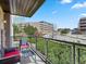 Relax on this private balcony with comfortable seating and a view of the surrounding neighborhood at 9019 E Panorama Cir # D204, Englewood, CO 80112