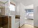 Bathroom with bathtub and shower combination and exterior view to bedroom at 9019 E Panorama Cir # D204, Englewood, CO 80112