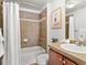 Cozy bathroom showcasing tiled shower and vanity with fresh towels, complete with shower and tub at 9019 E Panorama Cir # D204, Englewood, CO 80112