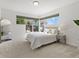 Bright bedroom with large windows and neutral decor at 9019 E Panorama Cir # D204, Englewood, CO 80112