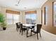 Bright dining room featuring tan walls and windows that fill the room with natural light at 9019 E Panorama Cir # D204, Englewood, CO 80112