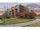 Attractive condo building with balconies and blooming trees, set in beautifully landscaped community at 9019 E Panorama Cir # D204, Englewood, CO 80112