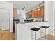 Functional kitchen with breakfast bar, washer and dryer, and ample cabinet and counter space at 9019 E Panorama Cir # D204, Englewood, CO 80112