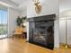 Cozy living room boasts a fireplace, neutral tones, and a deer head mount at 9019 E Panorama Cir # D204, Englewood, CO 80112
