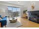 Bright living room featuring a fireplace, balcony, and a comfortable seating area with nice decor at 9019 E Panorama Cir # D204, Englewood, CO 80112