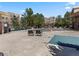 Inviting outdoor pool area features lounge chairs, surrounded by mature trees and greenery at 9019 E Panorama Cir # D204, Englewood, CO 80112