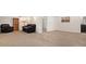 Finished basement area with comfortable seating and neutral carpeting at 6933 S Dahlia St, Centennial, CO 80122