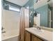 Clean bathroom with tub shower and updated vanity at 4936 Stoneham Ave, Castle Rock, CO 80104