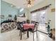 Cozy dining area with fireplace and access to the kitchen at 4936 Stoneham Ave, Castle Rock, CO 80104