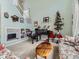 Living room with built-ins, a piano, and a Christmas tree at 4936 Stoneham Ave, Castle Rock, CO 80104