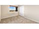 Neutral bedroom with closet, window, and carpeted flooring at 2405 Calais Dr # 18A, Longmont, CO 80504