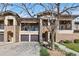 Charming townhome with stone accents, two car garage, and balcony views at 2405 Calais Dr # 18A, Longmont, CO 80504