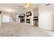Open concept living room featuring a fireplace and vaulted ceilings at 2405 Calais Dr # 18A, Longmont, CO 80504
