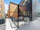A contemporary home with a cozy backyard, black metal railing, and outdoor seating at 1601 Park Ave # 212, Denver, CO 80218