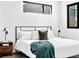 Modern bedroom with a minimalist design, black window frames, and natural light at 1601 Park Ave # 212, Denver, CO 80218