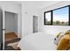 Bright bedroom featuring a walk-in closet and large window to allow for plenty of sunlight at 1601 Park Ave # 212, Denver, CO 80218