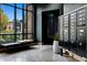 Modern lobby featuring a cozy bench, large windows, and secure mailboxes at 1601 Park Ave # 212, Denver, CO 80218