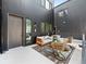 Outdoor patio featuring modern seating, a rug, and a hot tub at 1601 Park Ave # 212, Denver, CO 80218
