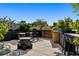 Spacious rooftop patio with grilling area, bar seating, and a cozy fire pit for outdoor enjoyment at 1601 Park Ave # 212, Denver, CO 80218