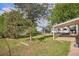 Spacious backyard with green grass and mature trees offers a serene outdoor space at 201 4Th St, Frederick, CO 80530