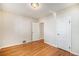 Bedroom featuring light walls, hardwood floors, and white doors, perfect for custom design at 201 4Th St, Frederick, CO 80530