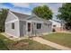 Gray painted home showing its well-manicured lawn at 201 4Th St, Frederick, CO 80530