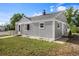 Exterior view of a gray painted single-Gathering home with well-manicured lawn at 201 4Th St, Frederick, CO 80530