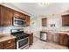 Modern kitchen with stainless steel appliances and granite countertops at 201 4Th St, Frederick, CO 80530