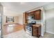 The kitchen has stainless steel appliances and brown cabinetry at 201 4Th St, Frederick, CO 80530