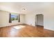Cozy living room featuring hardwood floors and an open doorway at 201 4Th St, Frederick, CO 80530