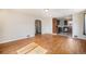 Open-concept living area with hardwood floors that seamlessly connects to the kitchen at 201 4Th St, Frederick, CO 80530