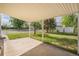 Covered patio provides space for outdoor relaxation, overlooking a well-maintained yard at 201 4Th St, Frederick, CO 80530
