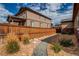 Side yard with a gravel path and wood fence at 25144 E Archer Pl, Aurora, CO 80018