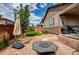 Beautiful backyard featuring a well-maintained lawn, patio, and lush landscaping at 25144 E Archer Pl, Aurora, CO 80018