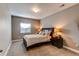 Comfortable bedroom with neutral walls, side tables with lamps, and soft, plush carpeting at 25144 E Archer Pl, Aurora, CO 80018
