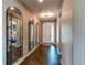 Elegant foyer featuring hardwood floors, stylish mirrors, and a decorative light fixture at 25144 E Archer Pl, Aurora, CO 80018