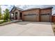 A well maintained three car garage complements this home's facade at 25144 E Archer Pl, Aurora, CO 80018