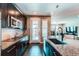 Well-equipped kitchen with stainless steel appliances, granite counters, and access to the backyard at 25144 E Archer Pl, Aurora, CO 80018