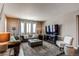 Comfortable living room with a cozy seating arrangement and a large television at 25144 E Archer Pl, Aurora, CO 80018