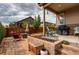 Spacious covered patio with comfortable seating and an outdoor grill, perfect for entertaining at 25144 E Archer Pl, Aurora, CO 80018