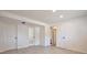 Finished basement with tile flooring, laundry room access, and recessed lighting at 9135 W Maplewood Ave, Littleton, CO 80123