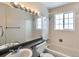 A stylish bathroom featuring tub/shower combination with modern fixtures at 9135 W Maplewood Ave, Littleton, CO 80123