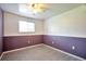 Bedroom with stylish wainscoting, window, and ceiling fan for added comfort at 9135 W Maplewood Ave, Littleton, CO 80123