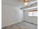 Bright, spacious bedroom with wood floors and a large window at 9135 W Maplewood Ave, Littleton, CO 80123