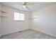Bright bedroom with a ceiling fan, natural light, and built-in shelves at 9135 W Maplewood Ave, Littleton, CO 80123