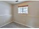 Cozy bedroom with tiled flooring and a window for natural light at 9135 W Maplewood Ave, Littleton, CO 80123